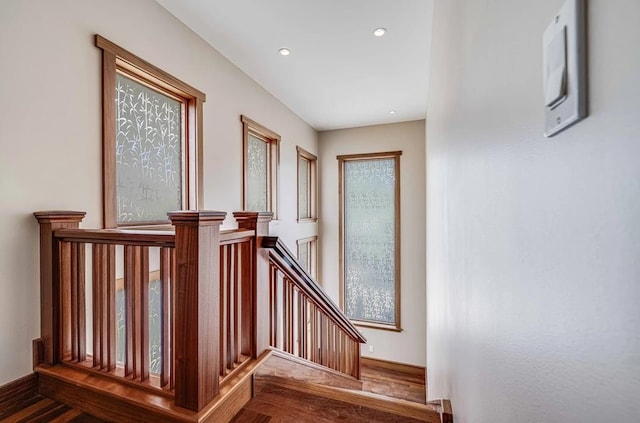 stairs with wood-type flooring