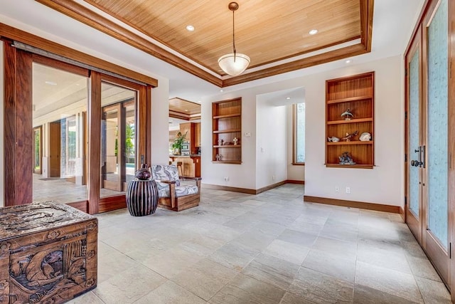 tiled entryway with a raised ceiling, french doors, and wood ceiling