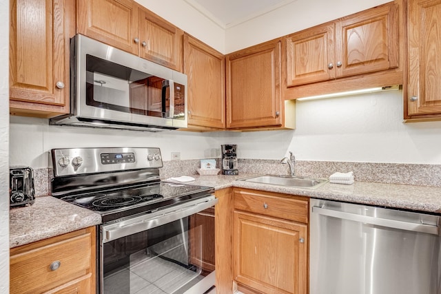 kitchen with sink and appliances with stainless steel finishes