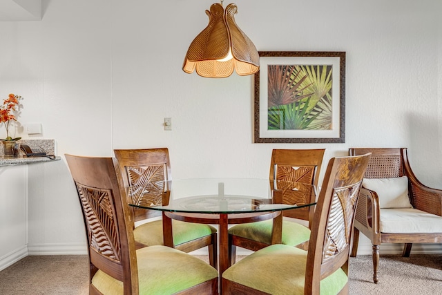 dining area featuring carpet flooring