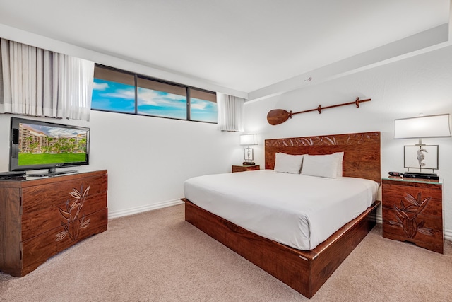 bedroom featuring light colored carpet