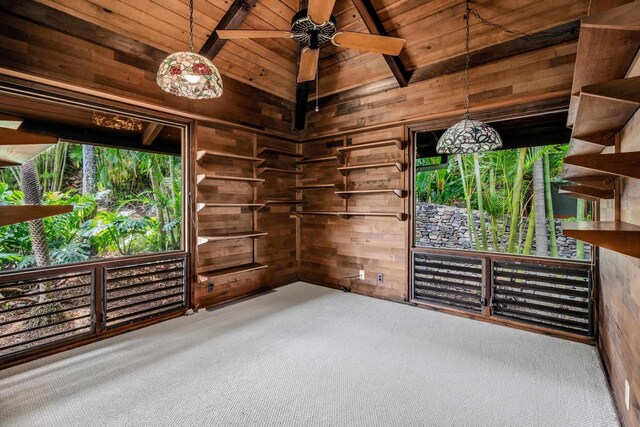29 Hale Malia Pl, Lahaina, HI 96761 - empty room featuring carpet flooring, wood ceiling, wooden walls, and a ceiling fan