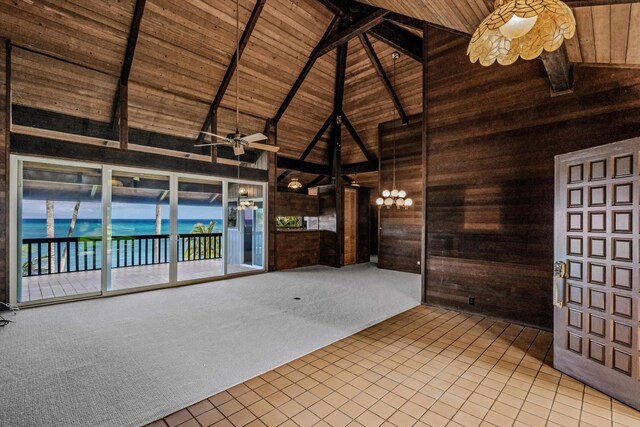 29 Hale Malia Pl, Lahaina, HI 96761 - tiled spare room featuring wooden ceiling with exposed beams, high vaulted ceiling, wood walls, a chandelier, and carpet