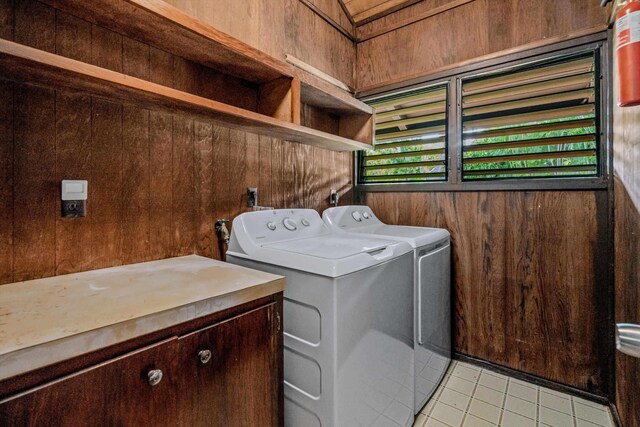29 Hale Malia Pl, Lahaina, HI 96761 - laundry room featuring separate washer and dryer, wood walls, and light tile patterned floors