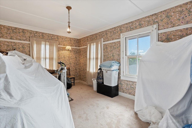 carpeted bedroom with baseboards, ornamental molding, and wallpapered walls