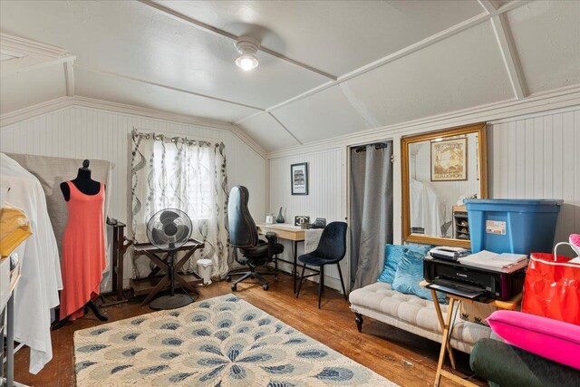 home office with wood finished floors, a ceiling fan, and vaulted ceiling