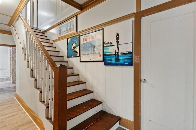 stairway featuring wood finished floors