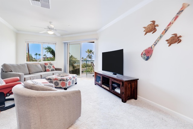 living room with ornamental molding, visible vents, light carpet, and baseboards