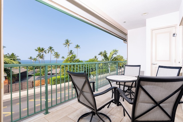 balcony featuring a water view