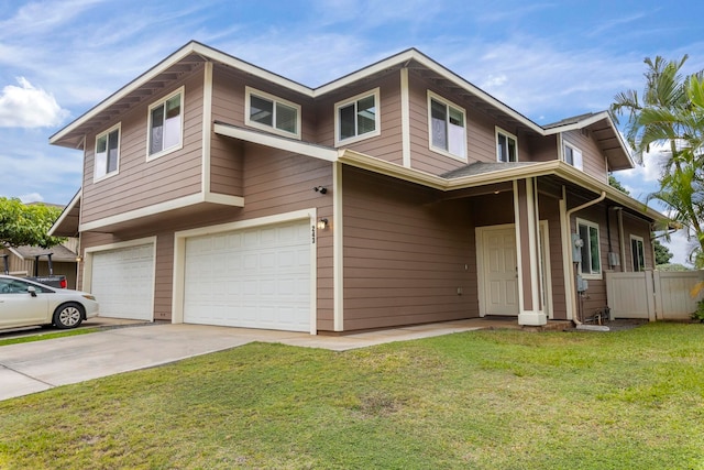 view of front of house featuring a garage and a front lawn