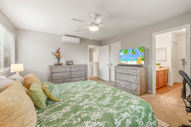 bedroom with ceiling fan, ensuite bathroom, light carpet, and a wall unit AC