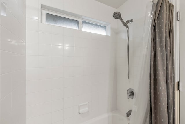 bathroom featuring shower / tub combo with curtain