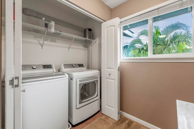 washroom with light colored carpet and washer and dryer