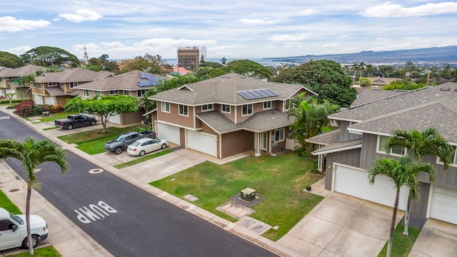 birds eye view of property with a mountain view