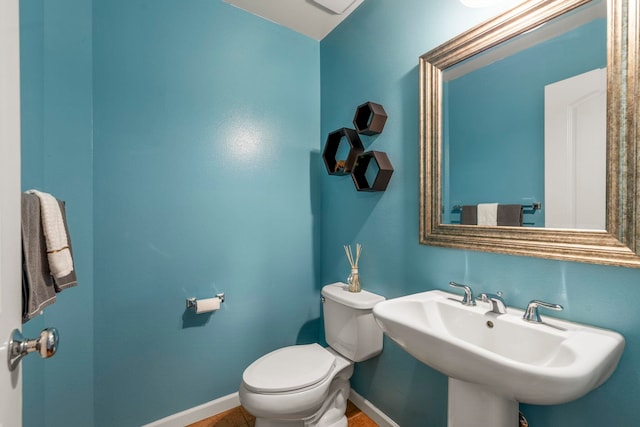 bathroom featuring sink and toilet