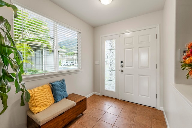 foyer with light tile patterned flooring