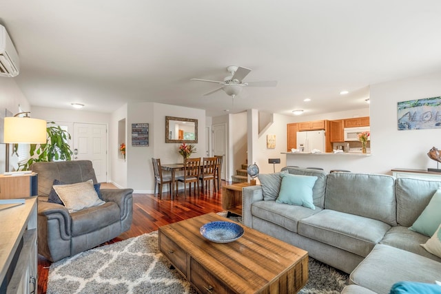 living room featuring dark hardwood / wood-style floors and ceiling fan