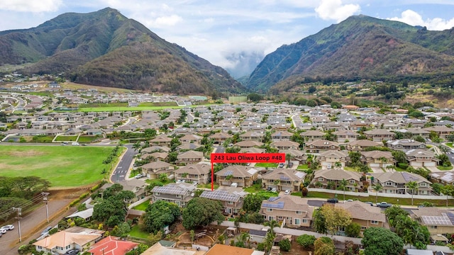 birds eye view of property featuring a mountain view