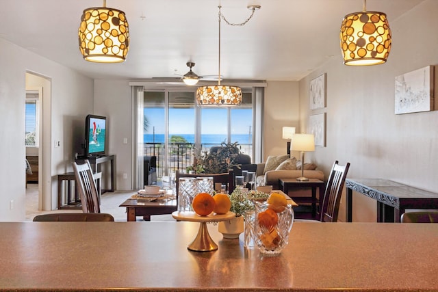 dining space with ceiling fan