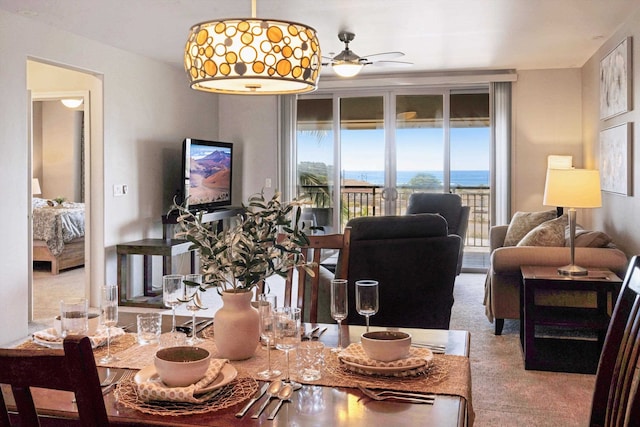 dining room with carpet flooring and ceiling fan