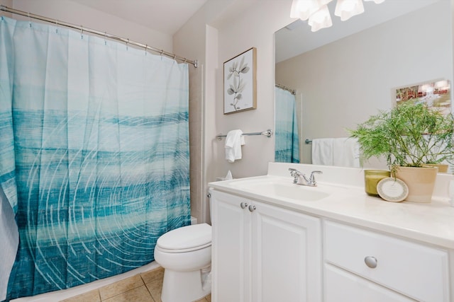 bathroom featuring vanity, a shower with curtain, toilet, and tile patterned floors