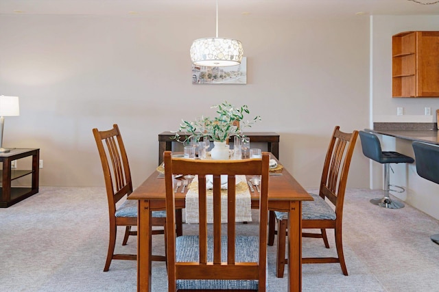 dining area with light carpet