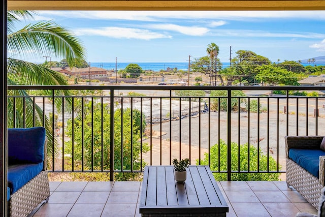 balcony featuring a water view