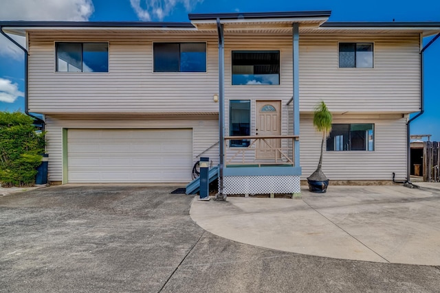 view of front of home featuring a garage and concrete driveway