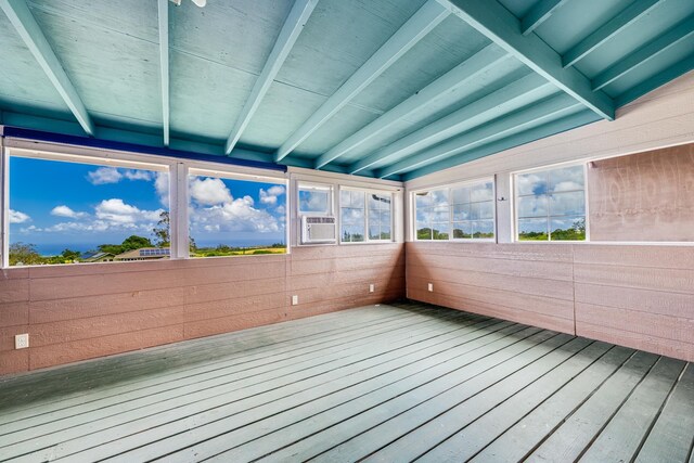 unfurnished sunroom with cooling unit