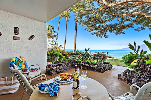 view of patio / terrace with a water view