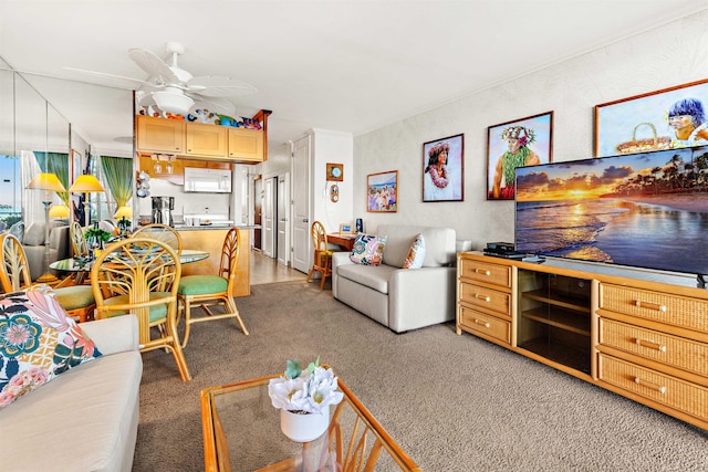 carpeted living room featuring ceiling fan