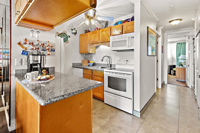 kitchen featuring white appliances, sink, crown molding, ceiling fan, and light tile patterned floors