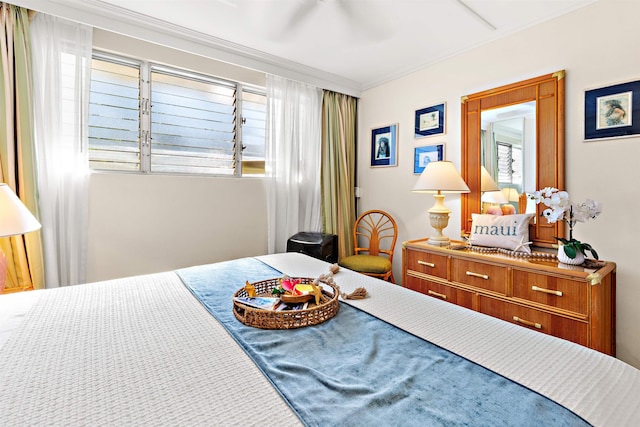 carpeted bedroom with ceiling fan and crown molding