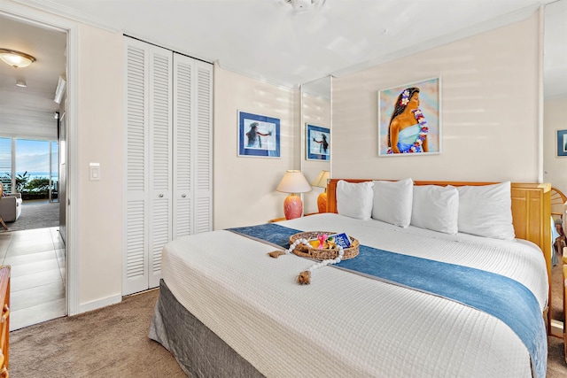 bedroom featuring light carpet and a closet