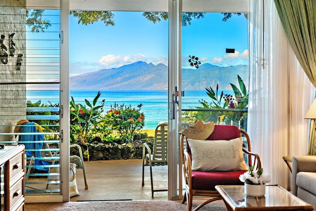 balcony with a water and mountain view