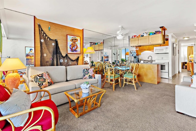 living room with ceiling fan and light tile patterned floors