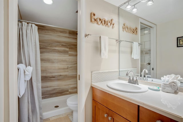 bathroom featuring vanity, tile patterned floors, toilet, tasteful backsplash, and curtained shower