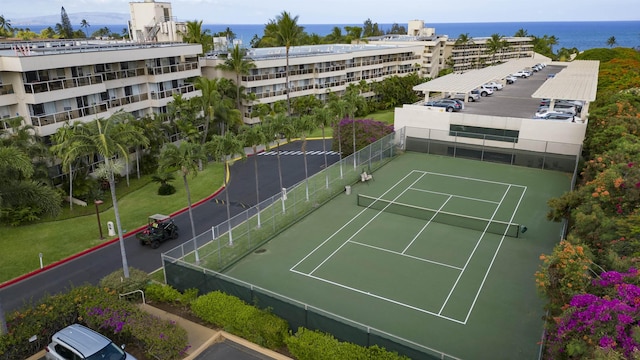 view of sport court featuring a water view