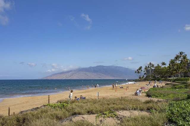 view of water feature featuring a beach view and a mountain view