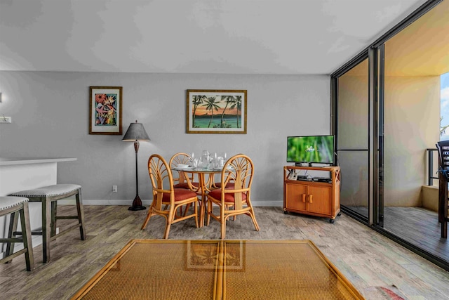 dining space with light hardwood / wood-style floors