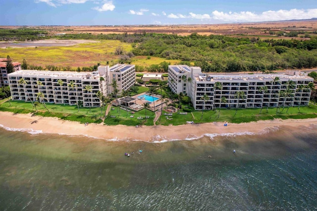 bird's eye view featuring a water view and a view of the beach