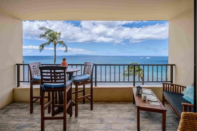 balcony featuring a water view