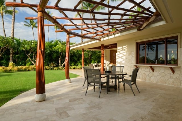 view of patio / terrace with a pergola and outdoor dining area