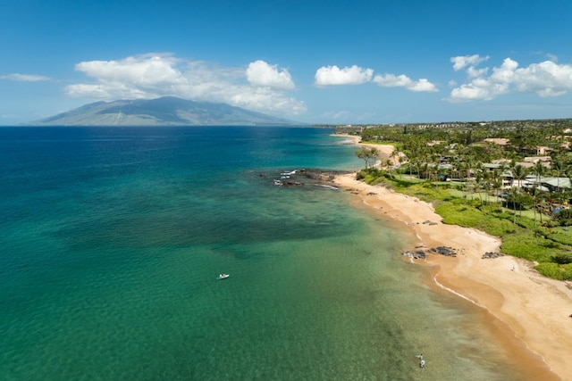 bird's eye view with a view of the beach and a water and mountain view