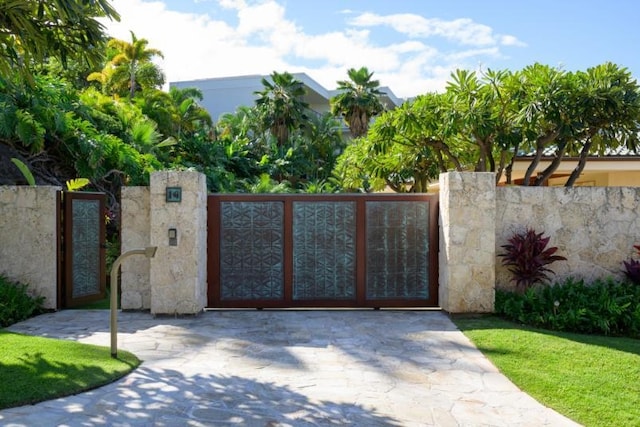 view of gate with fence