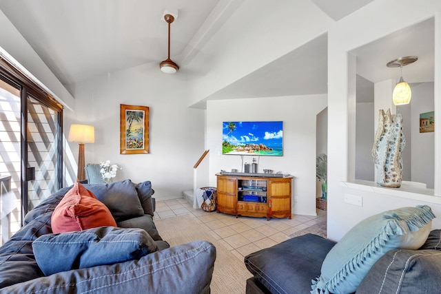 living room with lofted ceiling and light tile patterned floors