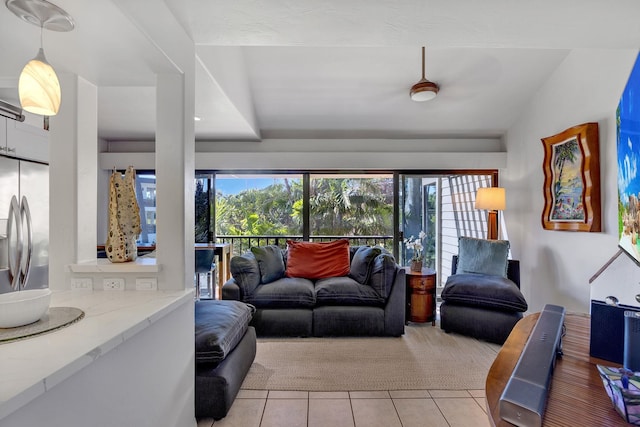 tiled living room with vaulted ceiling