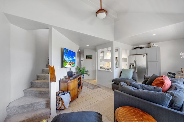 living room with vaulted ceiling and light tile patterned floors