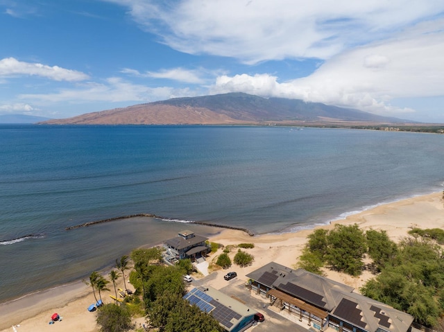 bird's eye view with a view of the beach and a water and mountain view