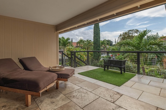 view of patio featuring a balcony